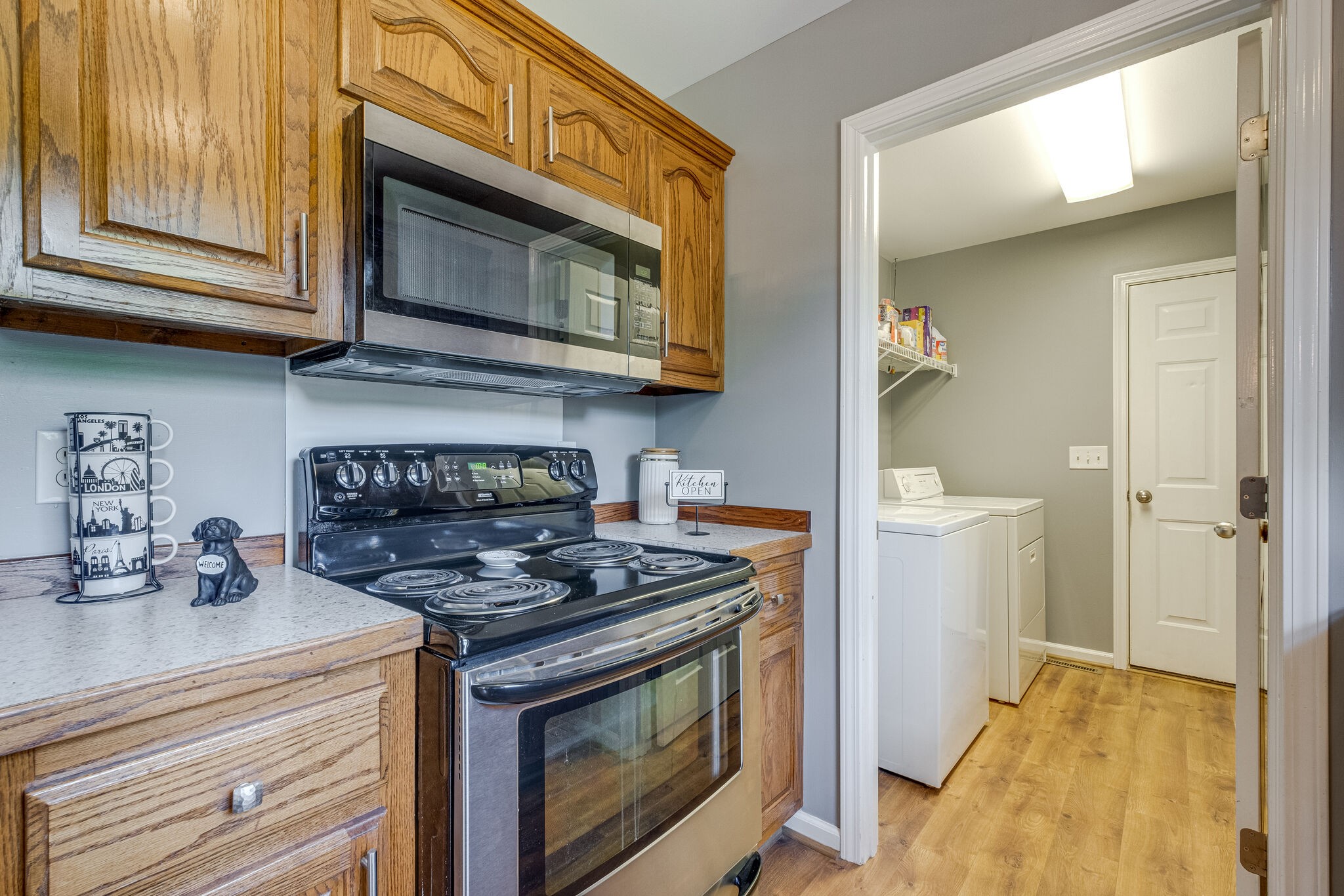 353 Beckwith Road Mount Juliet, TN 37122 - Photo 16 of 26 a kitchen with stainless steel appliances granite countertop a stove and a microwave