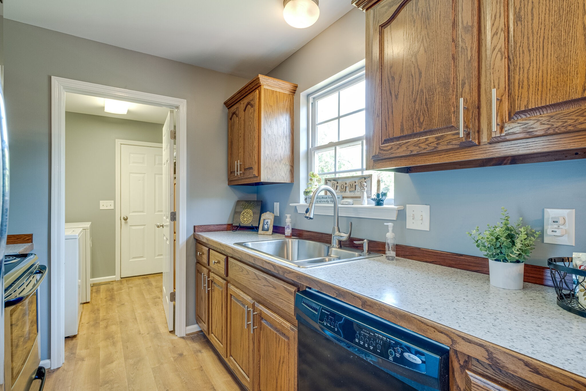 353 Beckwith Road Mount Juliet, TN 37122 - Photo 17 of 26 a kitchen with stainless steel appliances granite countertop a sink a stove cabinets and wooden floor