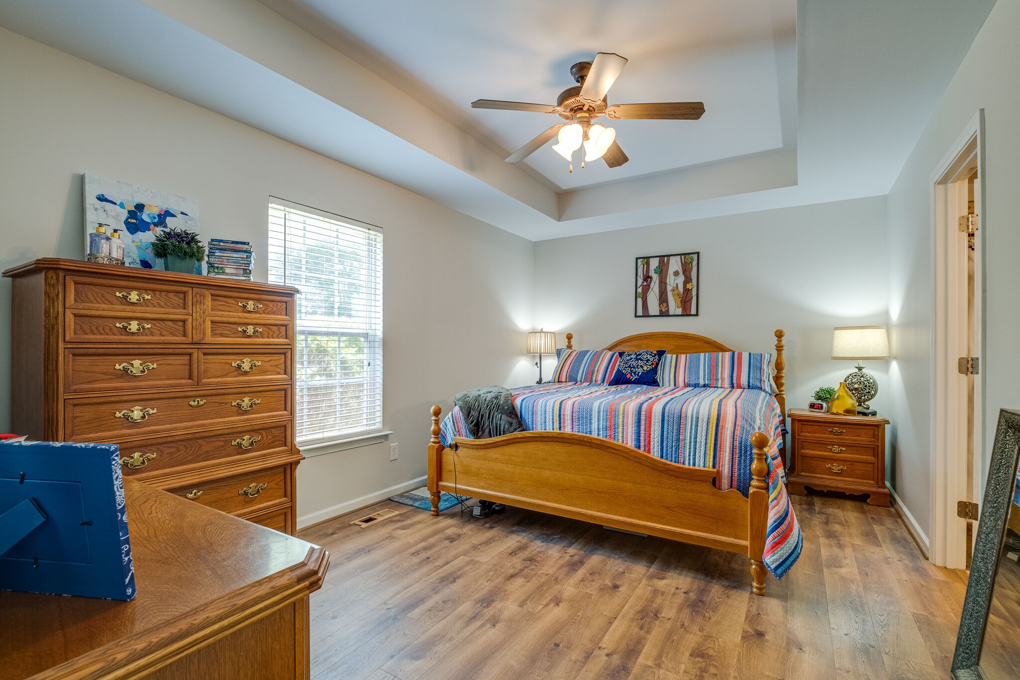 353 Beckwith Road Mount Juliet, TN 37122 - Photo 21 of 26 a bedroom with a bed and a chandelier