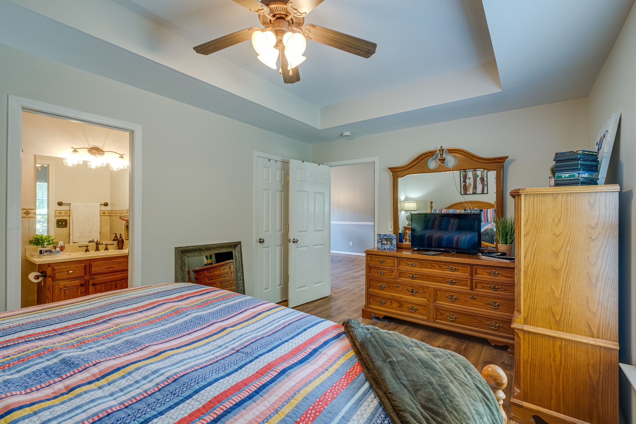353 Beckwith Road Mount Juliet, TN 37122 - Photo 22 of 26 a bedroom with a bed and a chandelier