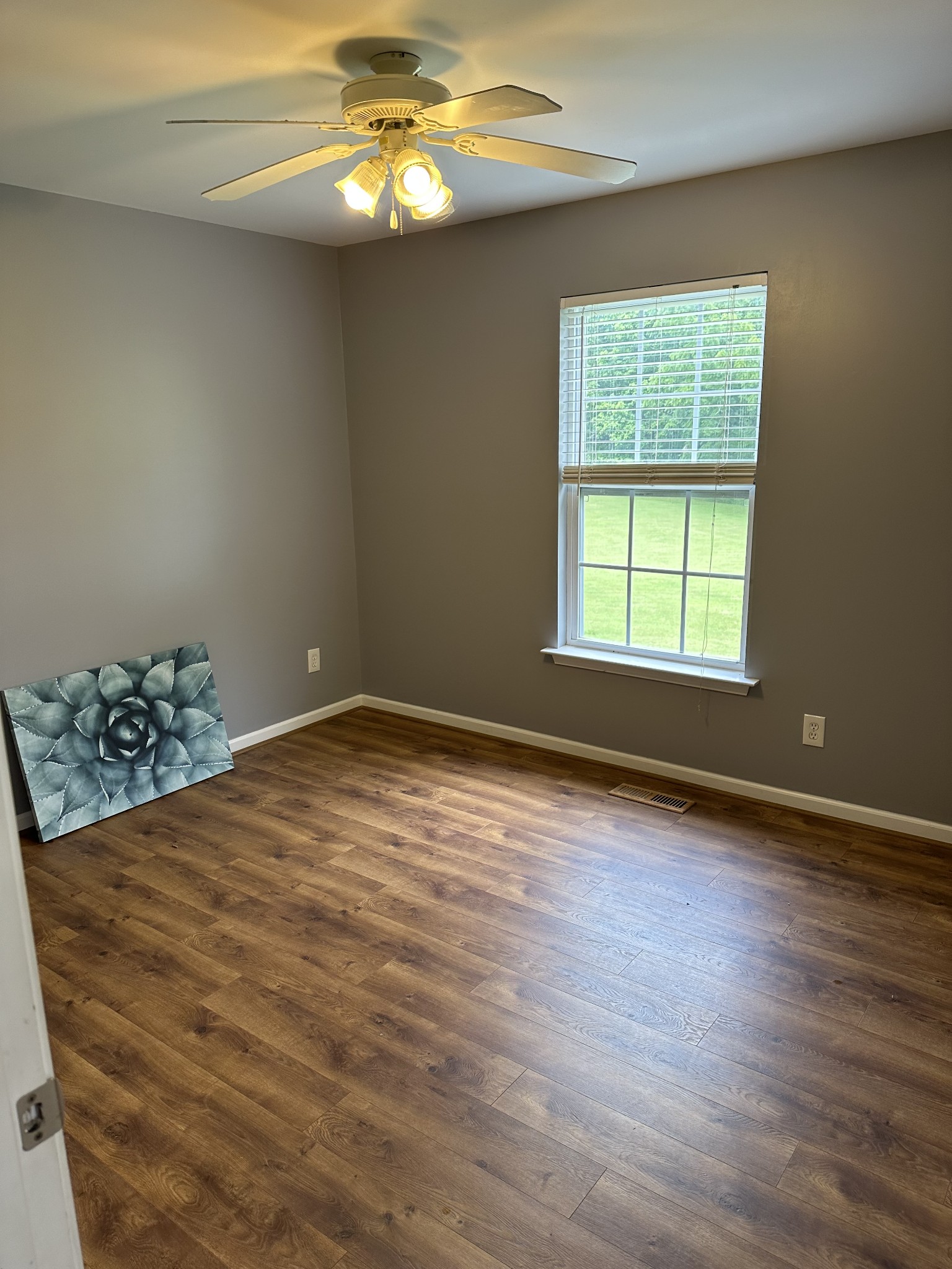 353 Beckwith Road Mount Juliet, TN 37122 - Photo 23 of 26 a view of an empty room with wooden floor and a window