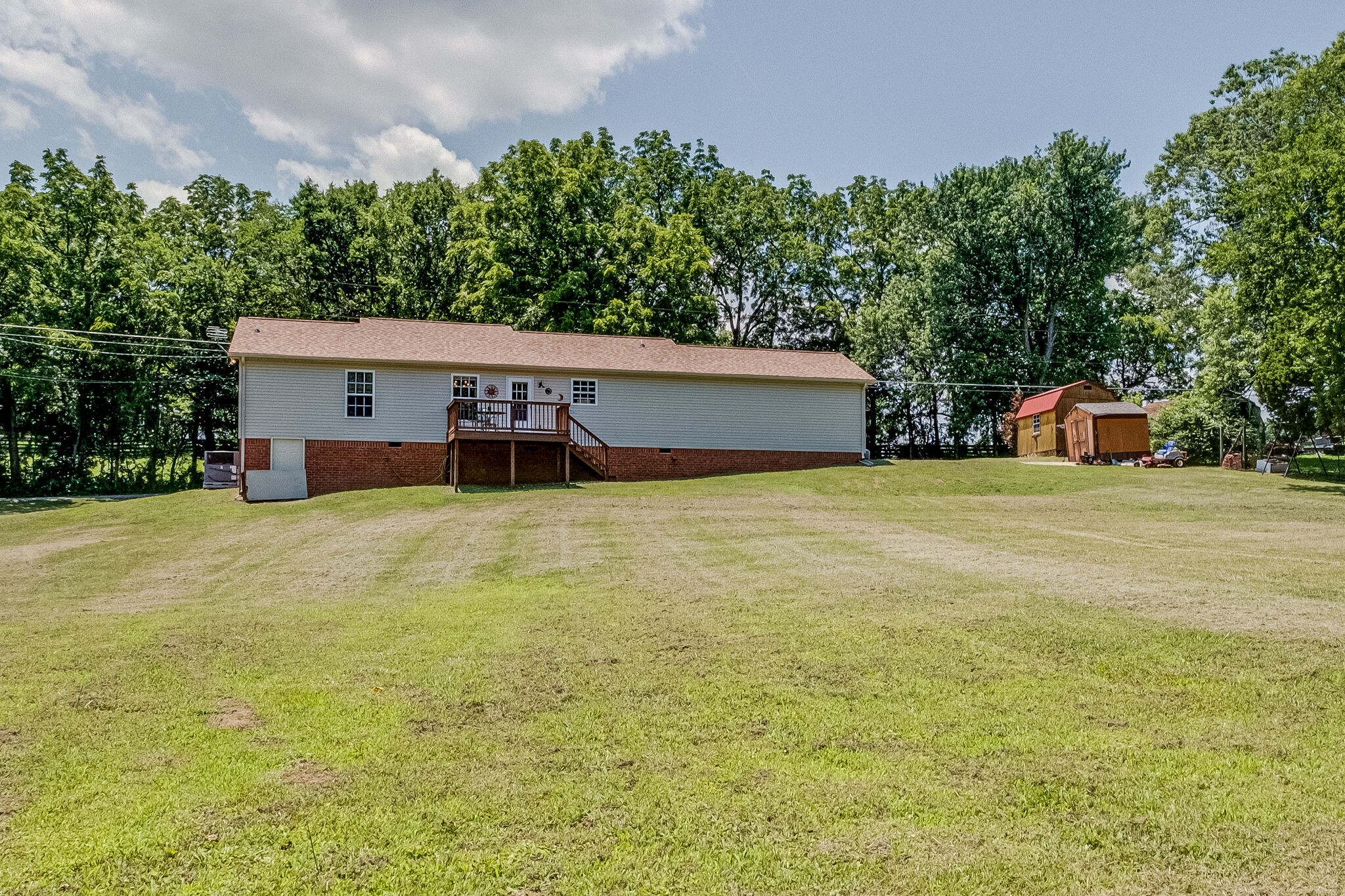 353 Beckwith Road Mount Juliet, TN 37122 - Photo 7 of 26 a view of a swimming pool with an outdoor space and seating area