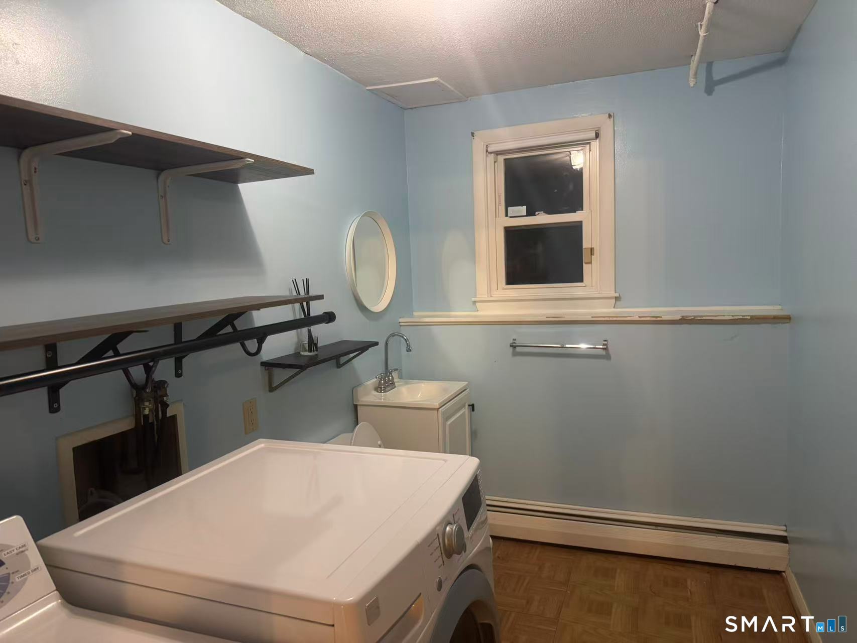 1122 Fienemann Road Farmington, CT 06032 - Photo 15 of 26 a bathroom with a toilet and a window