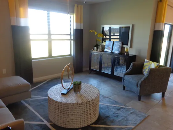 a living room with furniture and a window