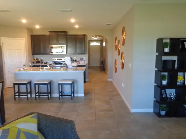 a kitchen with a table and chairs in it