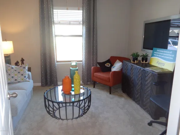 a bedroom with a bed and cabinets