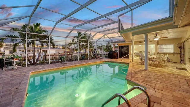 a view of a swimming pool with a patio