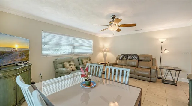 a spacious bedroom with a bed and a chandelier