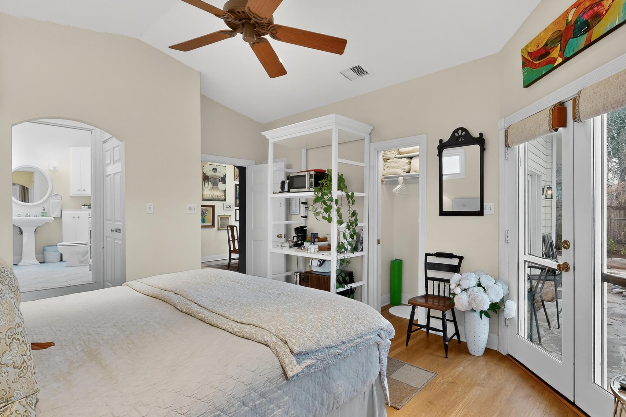 1906 Collier Street Austin, TX 78704 - Photo 16 of 40 a bedroom with a bed a dresser and book shelf