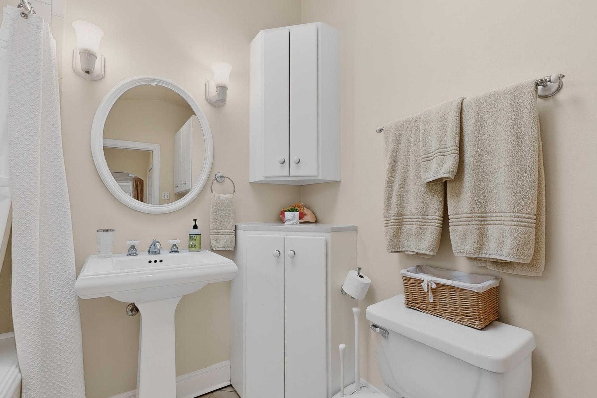 1906 Collier Street Austin, TX 78704 - Photo 17 of 40 Full primary bathroom with extra storage, two closets and space for a stack-able washer and dryer.