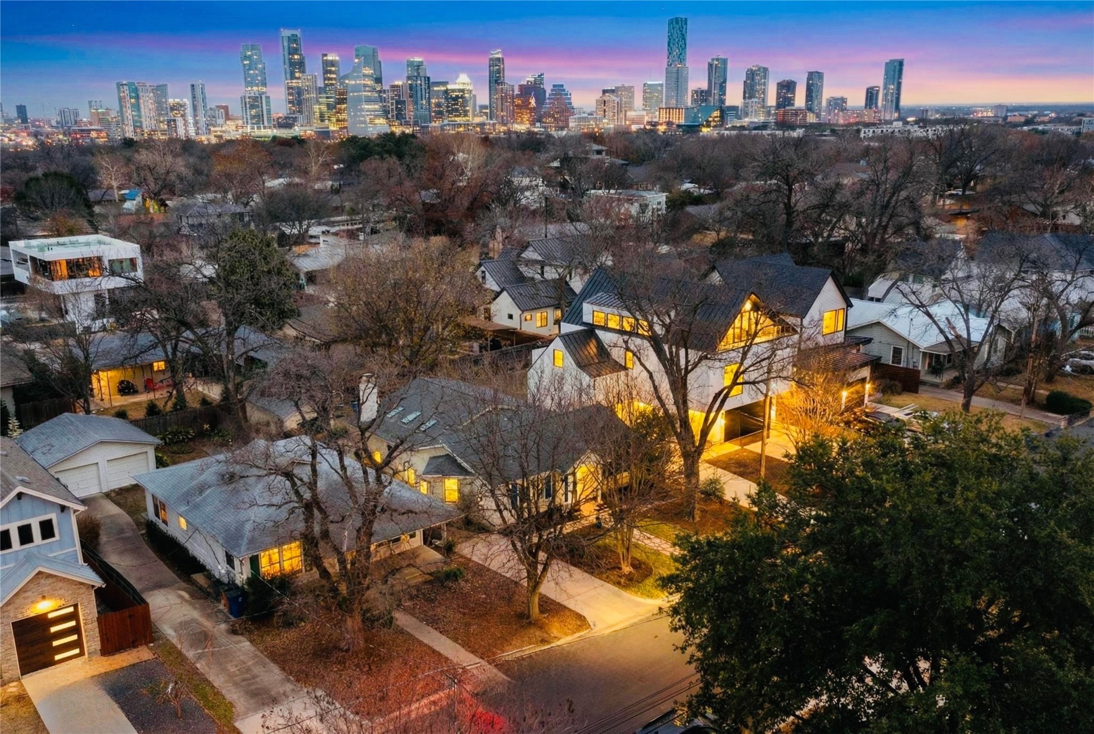 1906 Collier Street Austin, TX 78704 - Photo 2 of 40 Aerial view at dusk of a neighborhood.