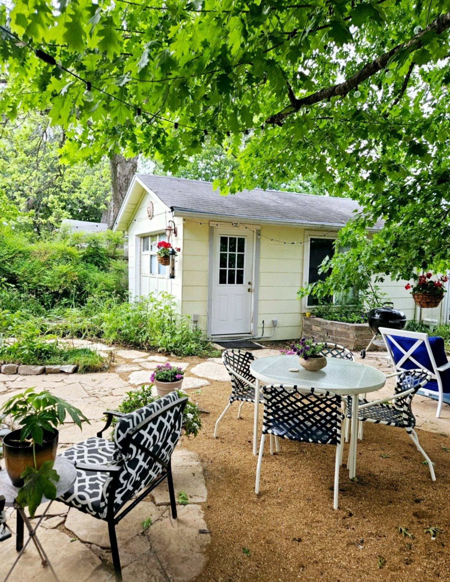 1906 Collier Street Austin, TX 78704 - Photo 32 of 40 a view of a chairs and table in backyard of a house