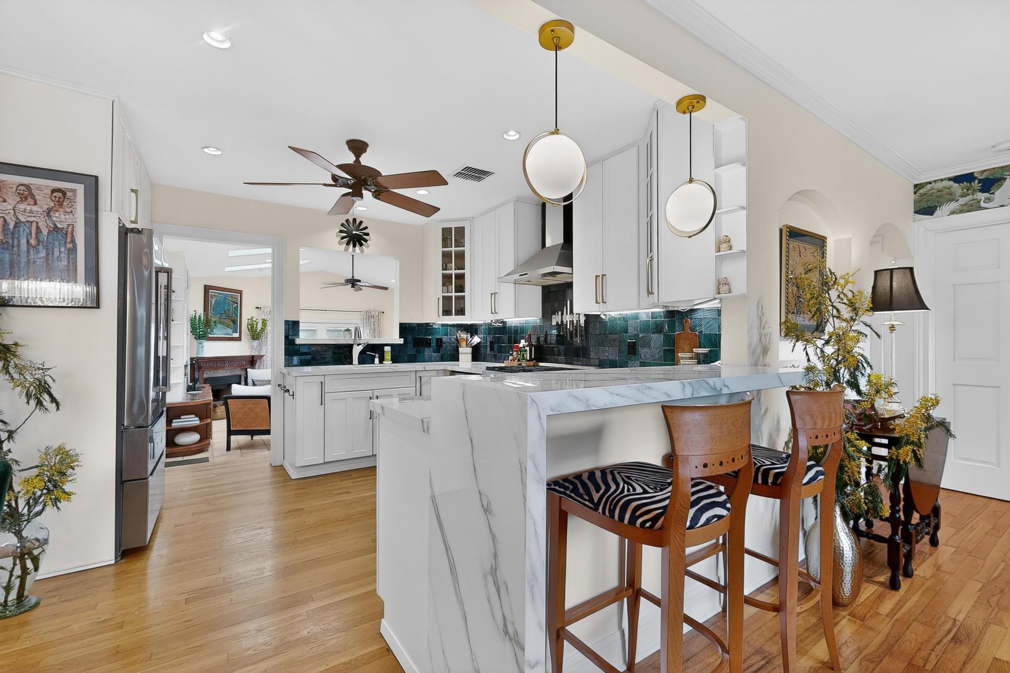 1906 Collier Street Austin, TX 78704 - Photo 4 of 40 a living room with furniture a flat screen tv and kitchen view