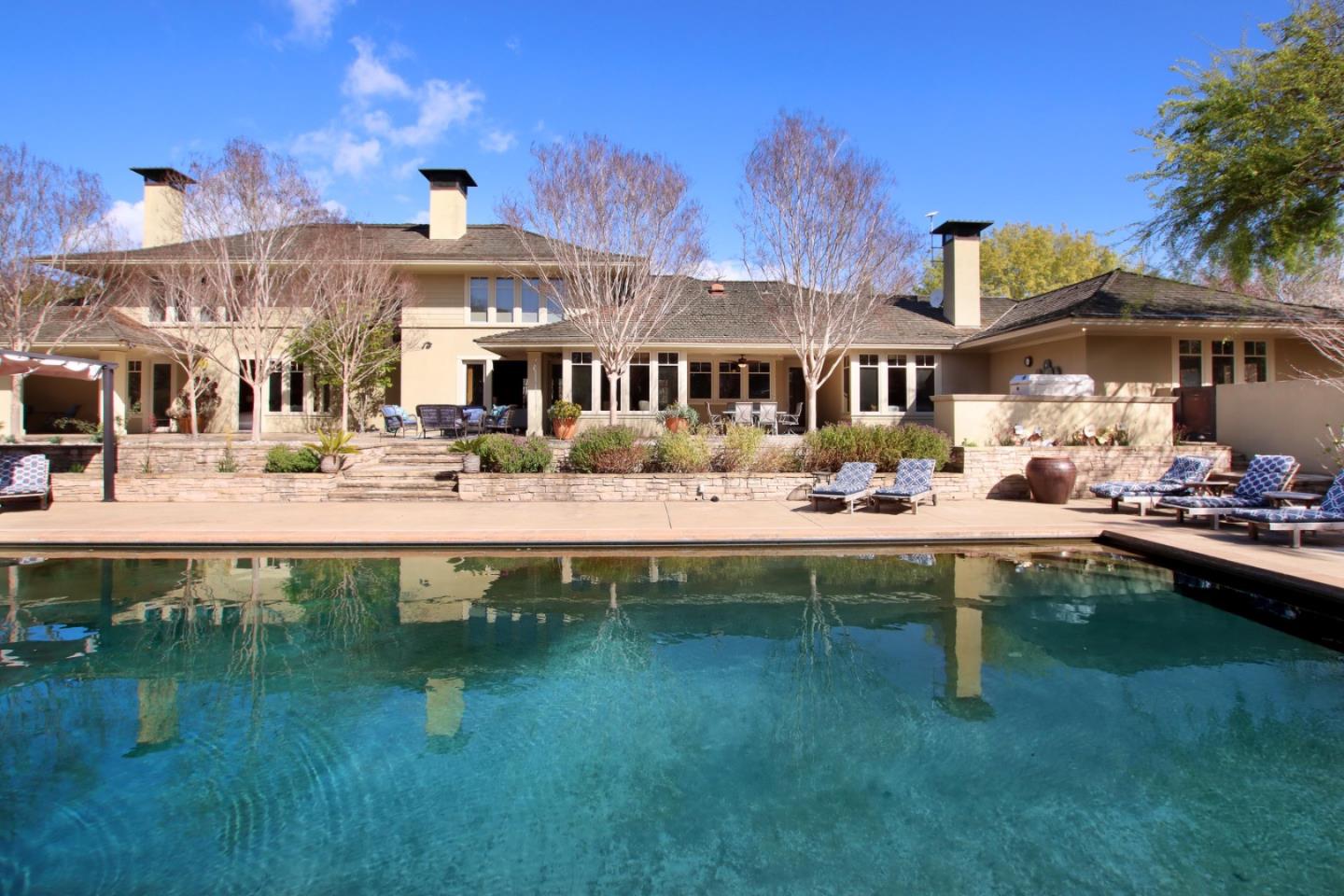 120 Edenvale Road Watsonville, CA 95076 - Photo 2 of 68 a front view of a house with swimming pool table and chairs