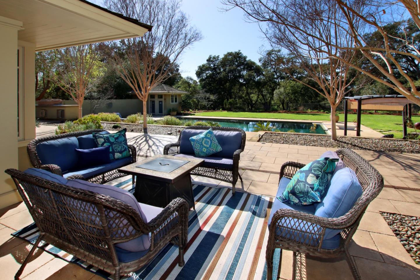 120 Edenvale Road Watsonville, CA 95076 - Photo 29 of 68 a view of patio with couches table and chairs under an umbrella