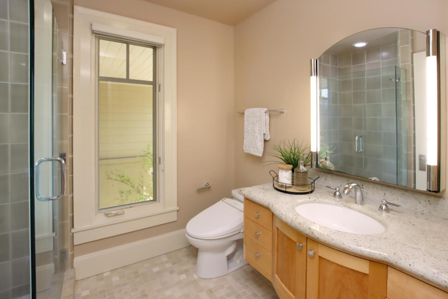 120 Edenvale Road Watsonville, CA 95076 - Photo 49 of 68 a bathroom with a granite countertop sink toilet and shower