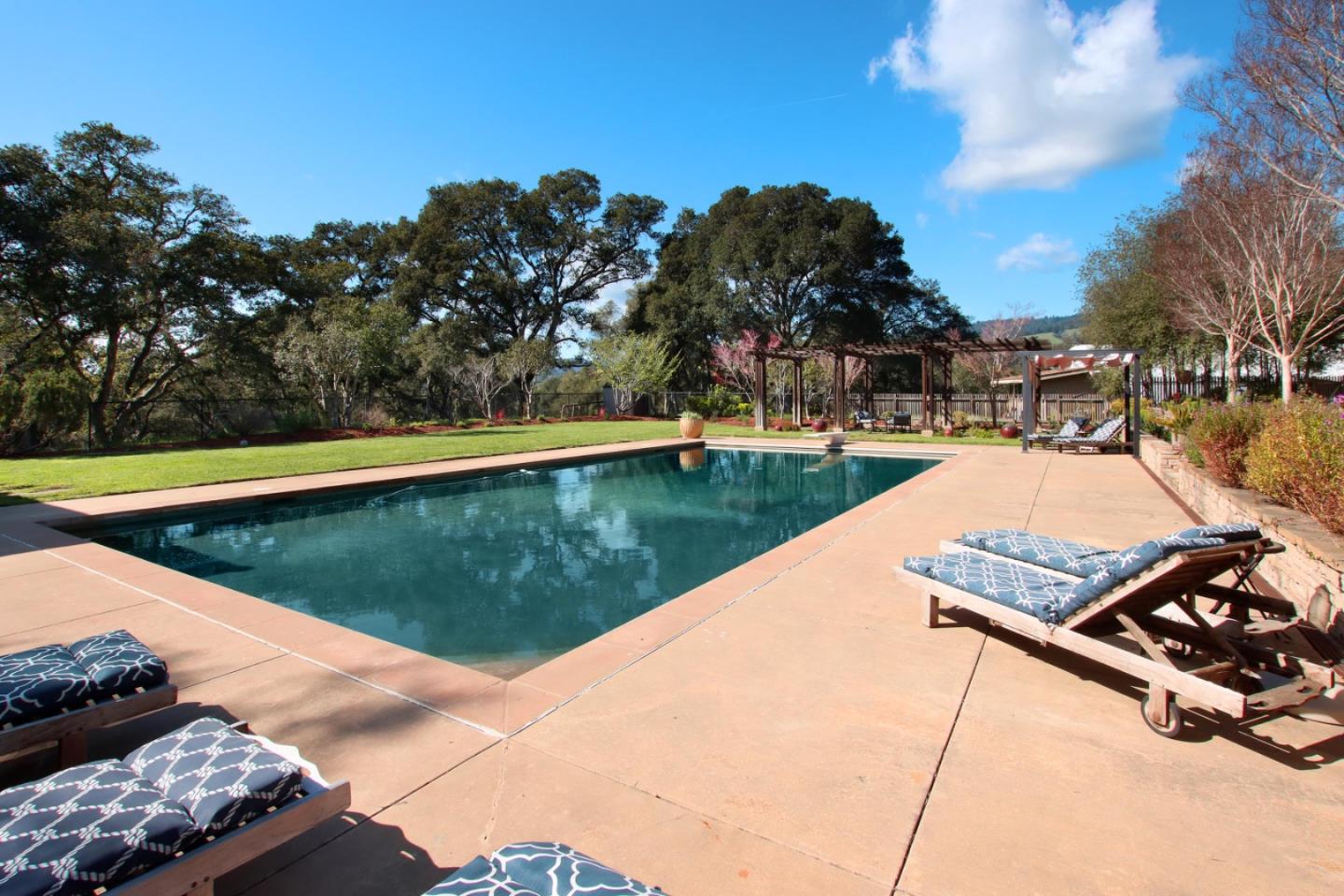 120 Edenvale Road Watsonville, CA 95076 - Photo 56 of 68 a view of a swimming pool with a yard and furniture