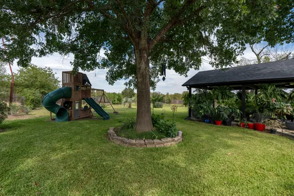 a view of a garden with a slide