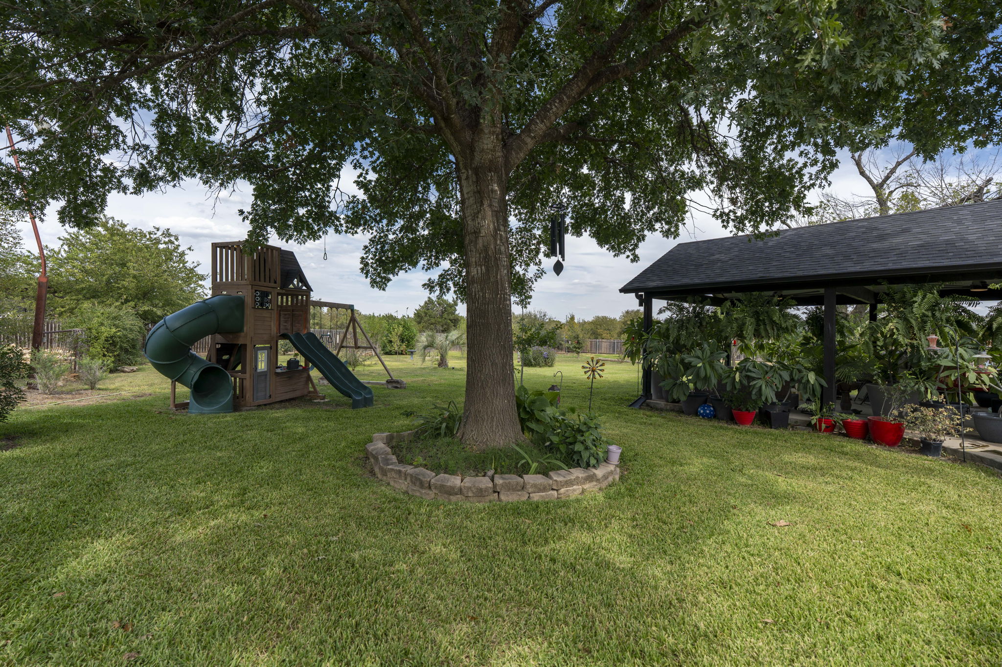 130 Hy Road Buda, TX 78610 - Photo 28 of 32 View of grassy yard with a playground