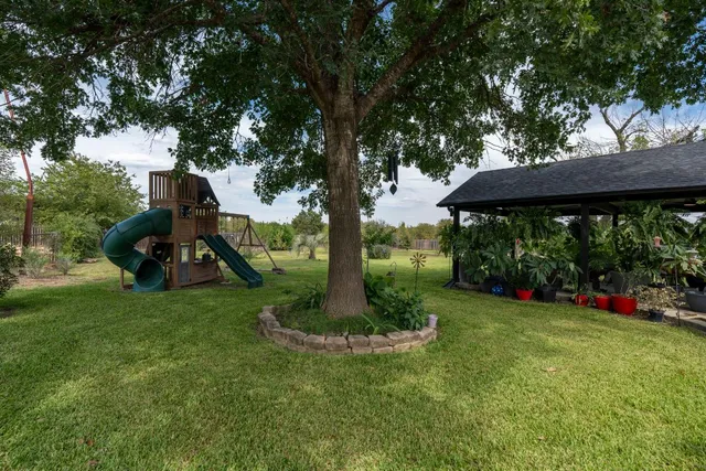 a view of a garden with a slide