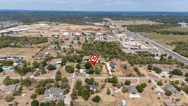a table with chairs and a potted plant on it