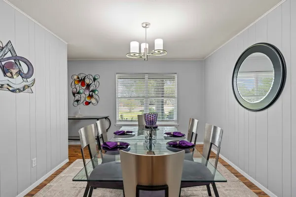 a view of a dining room with furniture window and wooden floor