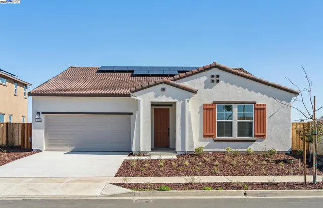a front view of a house with a garage
