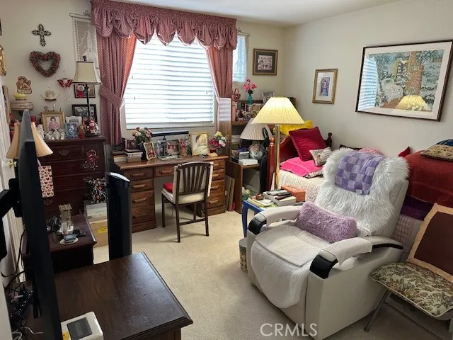 a living room with furniture and a lamp