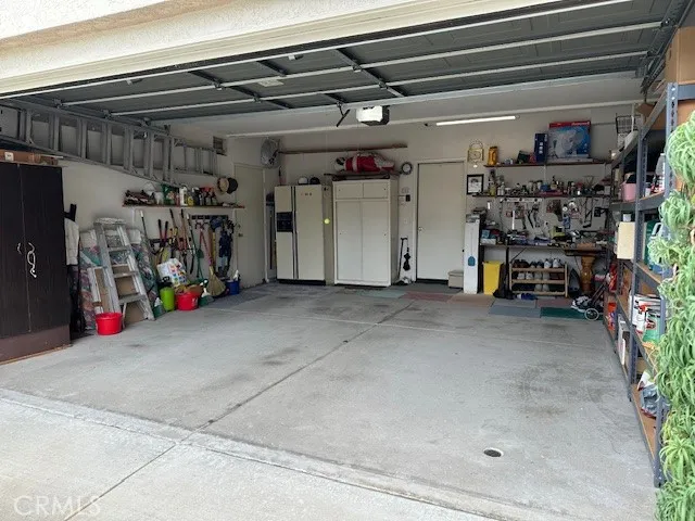 a view of a chairs and table in patio with a yard