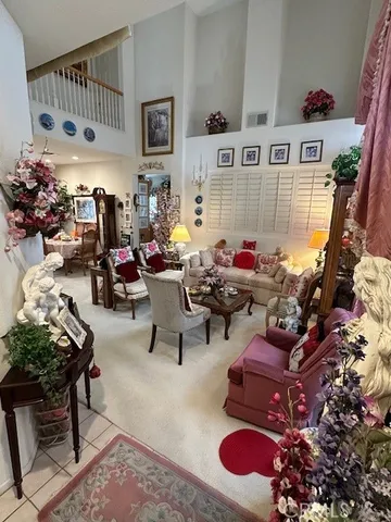 a living room with furniture and a bed