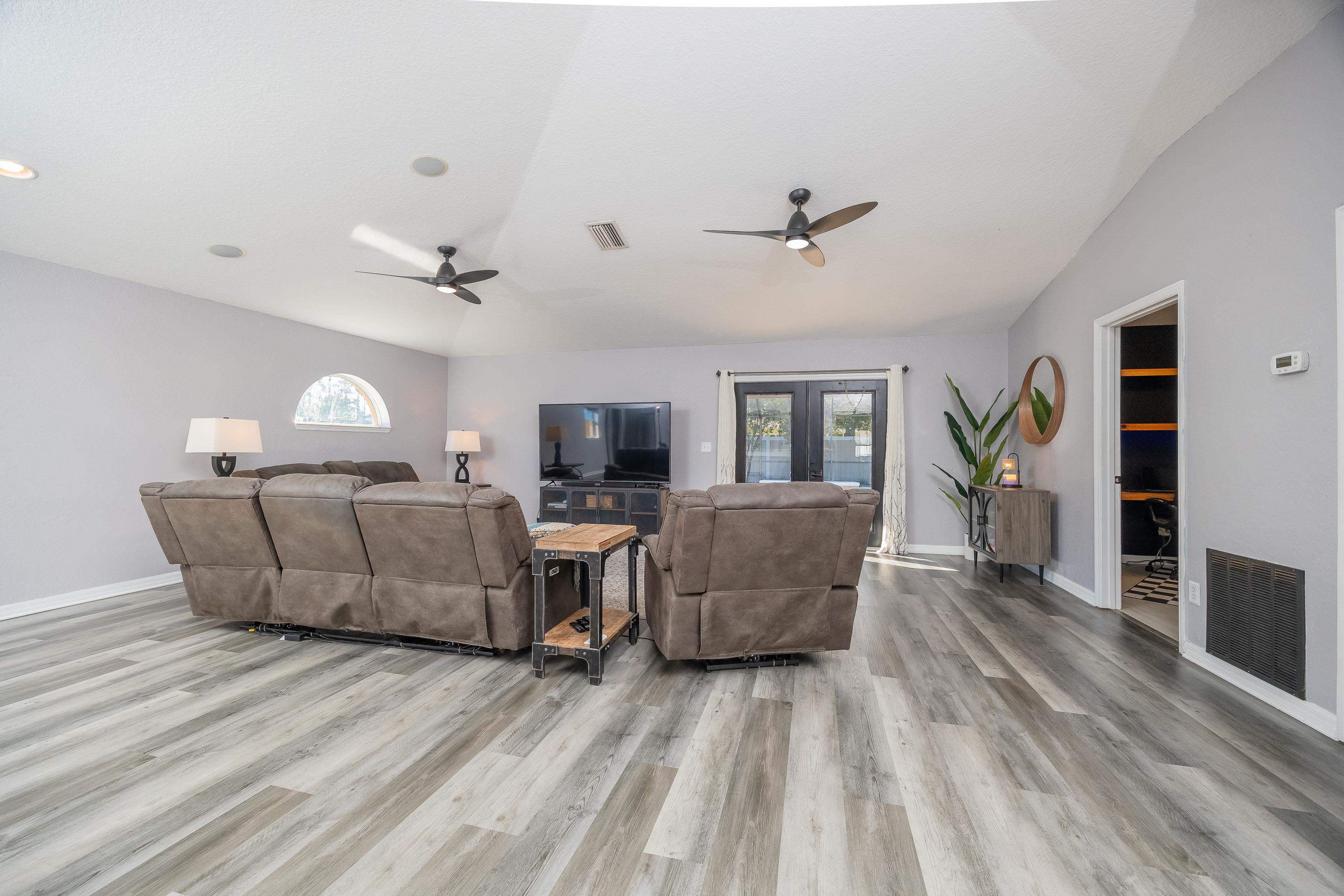 5 Rippling Place Palm Coast, FL 32164 - Photo 21 of 50 Living room with ceiling fan, french doors, and light wood finished floors