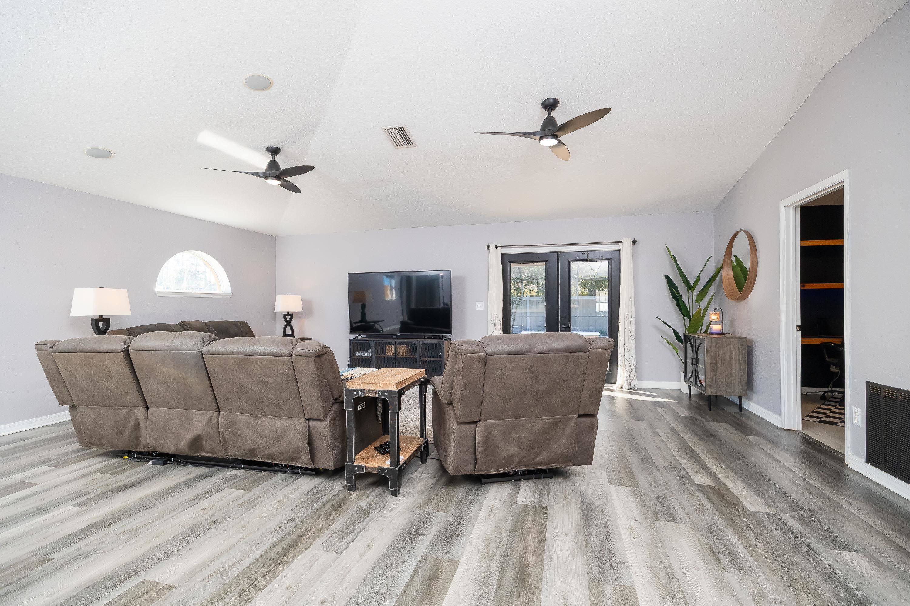 5 Rippling Place Palm Coast, FL 32164 - Photo 22 of 50 Living room featuring french doors, a ceiling fan, and light wood finished floors