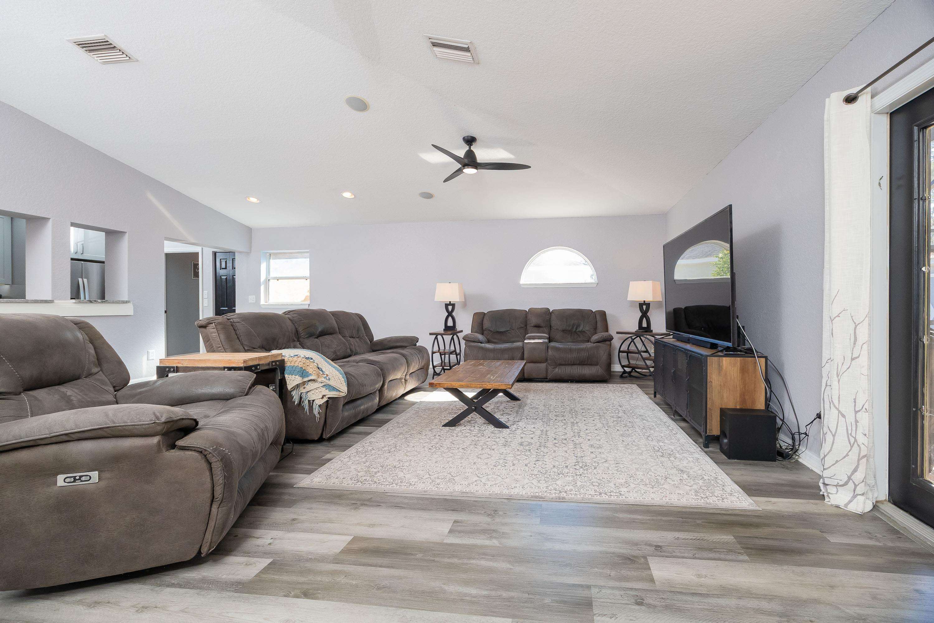 5 Rippling Place Palm Coast, FL 32164 - Photo 23 of 50 Living area featuring wood finished floors and ceiling fan