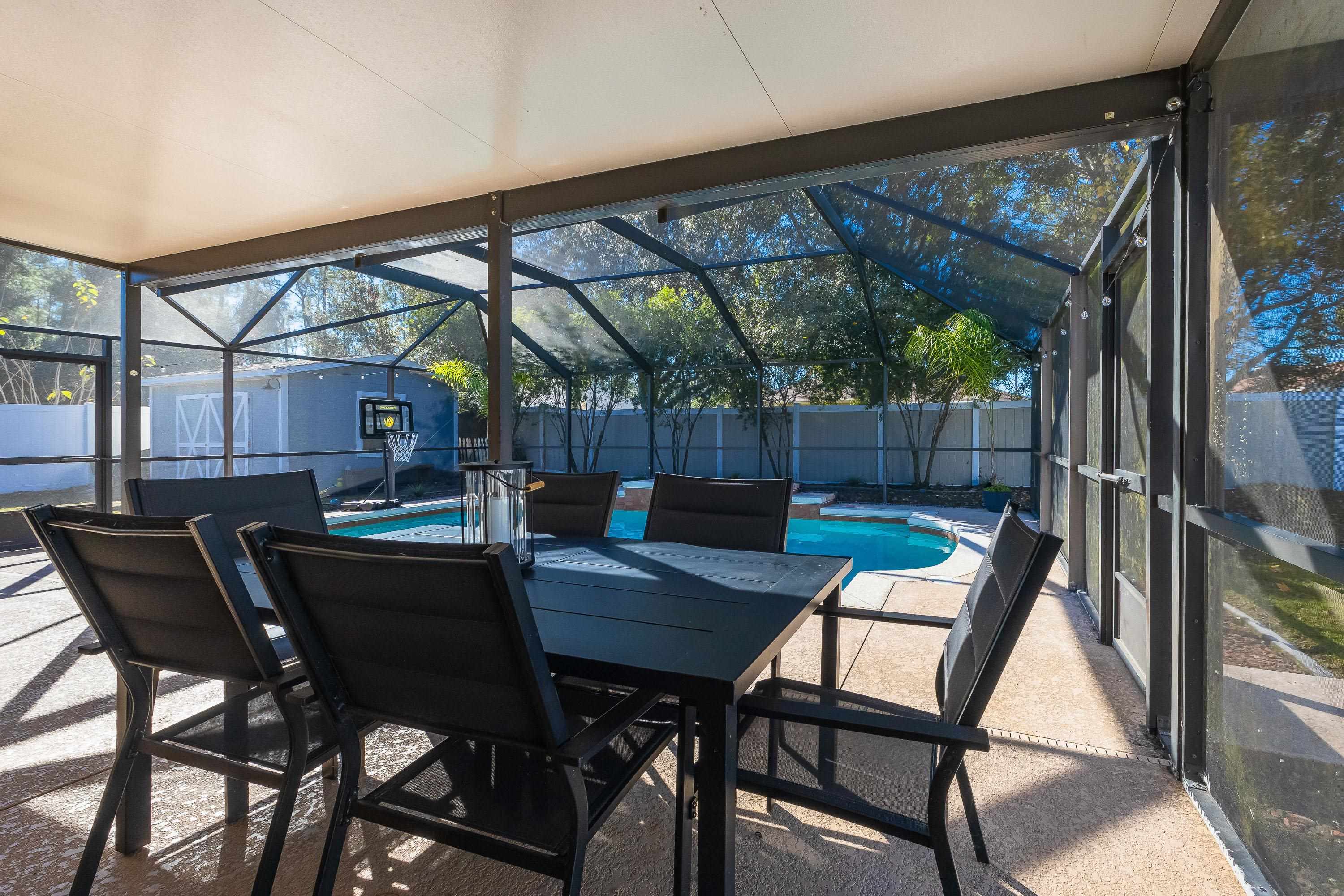 5 Rippling Place Palm Coast, FL 32164 - Photo 28 of 50 Sunroom / solarium with a patio and outdoor dining space