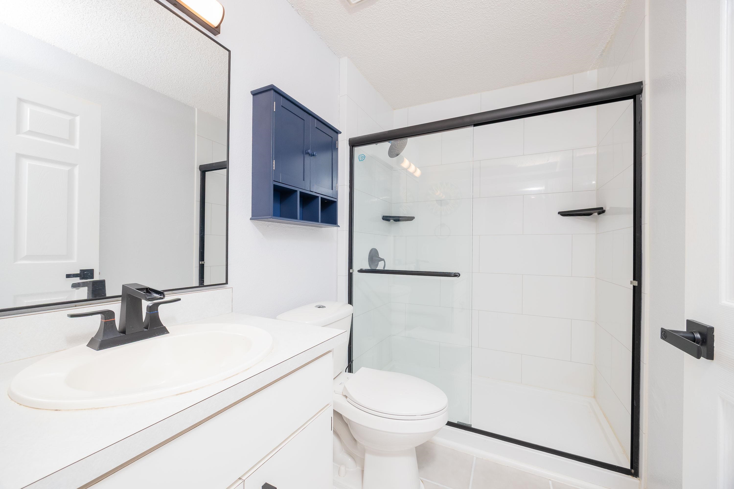 5 Rippling Place Palm Coast, FL 32164 - Photo 41 of 50 Full bathroom featuring vanity, a stall shower, and a textured ceiling