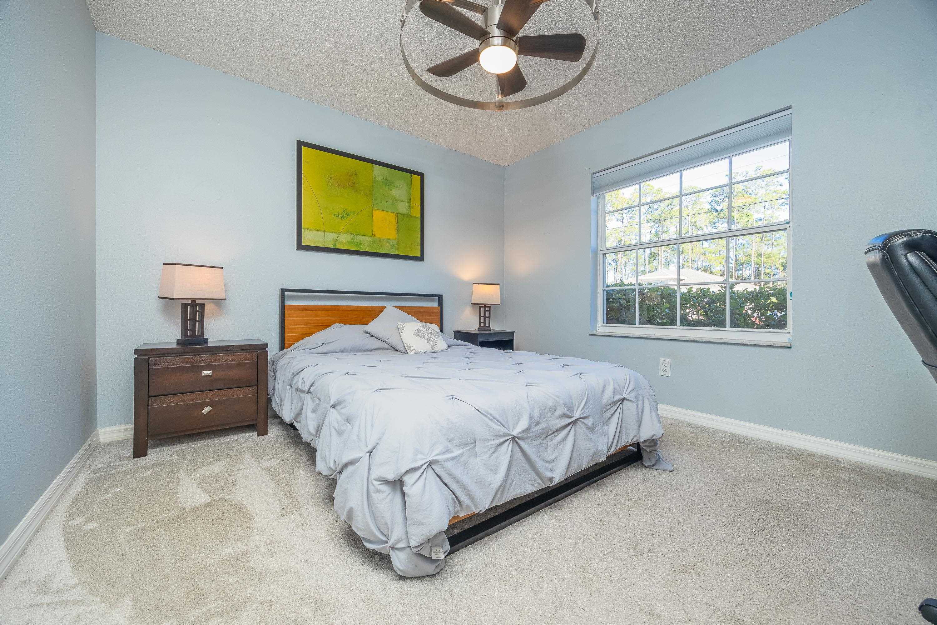 5 Rippling Place Palm Coast, FL 32164 - Photo 42 of 50 Bedroom featuring carpet flooring, a textured ceiling, and ceiling fan