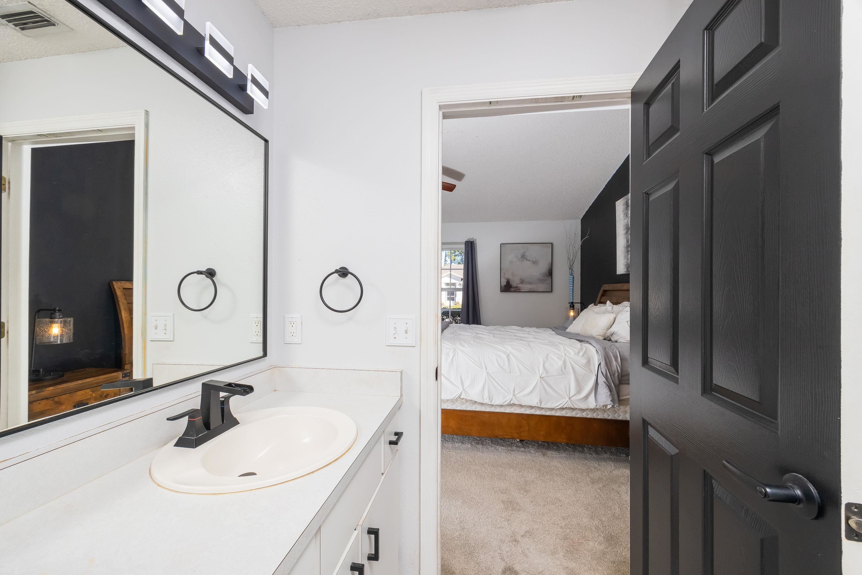 5 Rippling Place Palm Coast, FL 32164 - Photo 50 of 50 Ensuite bathroom featuring vanity and light carpet