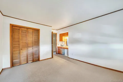 a view of empty room with floor to ceiling window