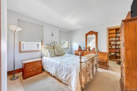 a bedroom with a bed and a table