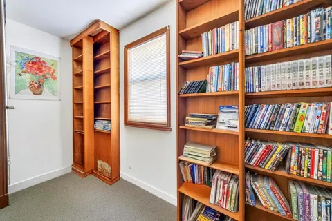 a view of room with book shelf and book shelf