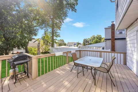 a view of balcony with furniture and wooden deck