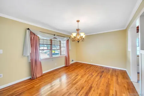 a view of livingroom with hardwood floor and window