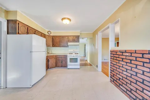 a kitchen with a refrigerator and a sink