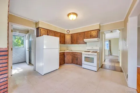 a kitchen with a refrigerator and a stove