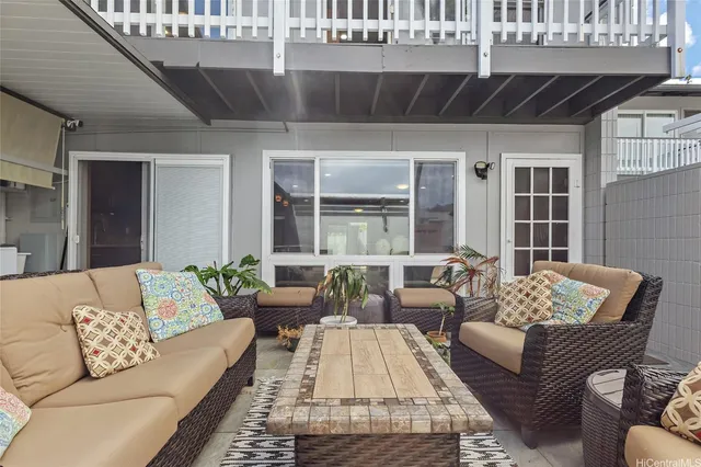 a outdoor living space with furniture and a potted plant