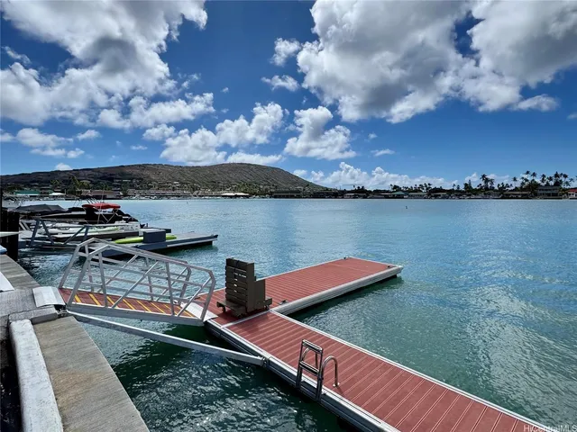 a view of a lake with houses in the back