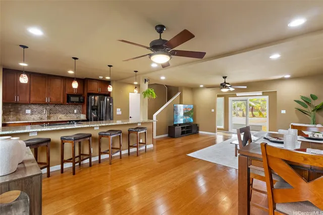 a large kitchen with lots of counter space dining table and chairs