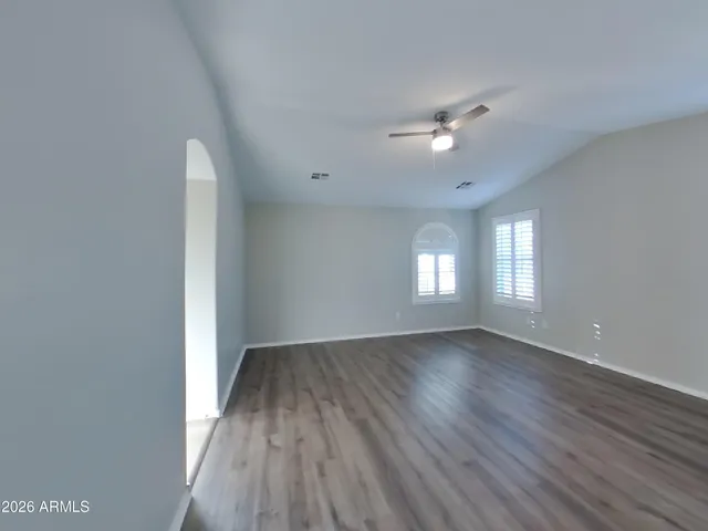 a large kitchen with a large counter top and stainless steel appliances
