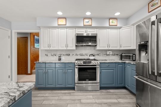 170 Millville Road Mendon, MA 01756 - Photo 11 of 33 a kitchen with stainless steel appliances granite countertop a stove a sink and a microwave