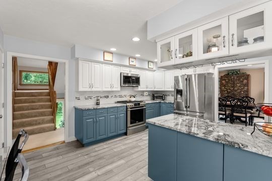 170 Millville Road Mendon, MA 01756 - Photo 12 of 33 a kitchen with stainless steel appliances kitchen island granite countertop a stove and a sink